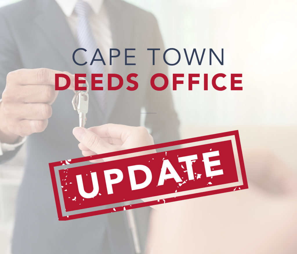 Property transfer documents with house keys on a contract